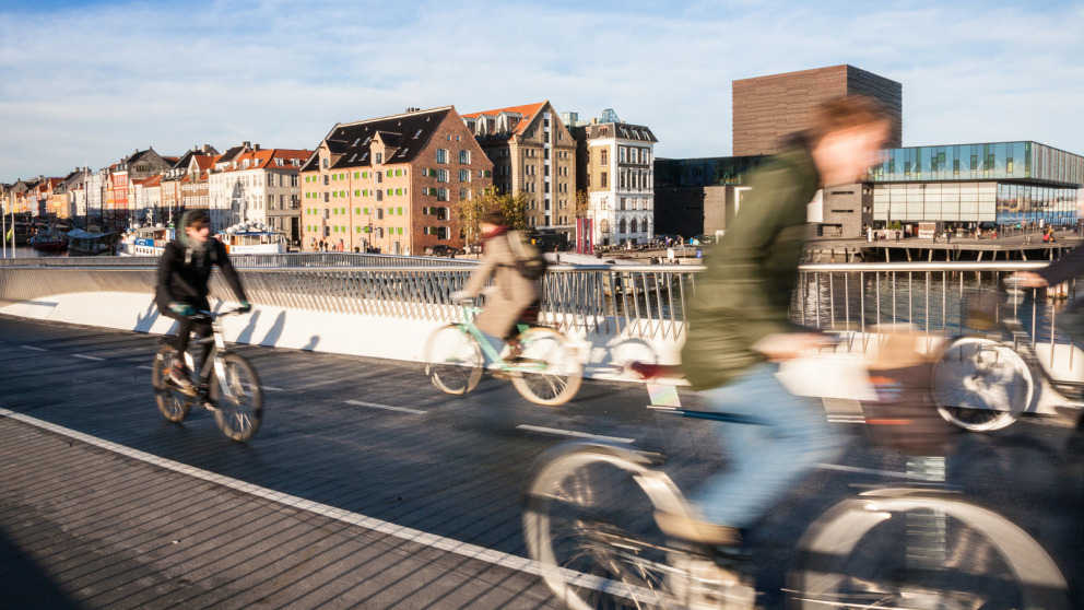 Cyclists cross the Bryggebroen bicycle and pedestrian bridge in Copenhagen.